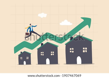 Housing price rising up, real estate or property growth concept, businessman running on rising green graph on house roof. Royalty-Free Stock Photo #1907467069