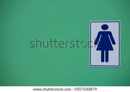Female symbol on green background 