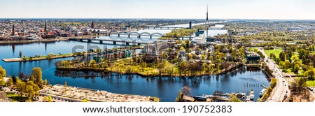 Panoramic aerial image horizontal photo of Riga cityscape centre capital of Latvia, Daugava river sunny spring day, banner for website header design, copy space. European city, horizon over land