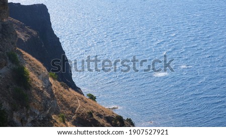 beach on cape Fiolent in Sevastopol, Crimea. View from the top of the rock. blue sea, sunny day clear sky background. The concept of place for summer travel and rest