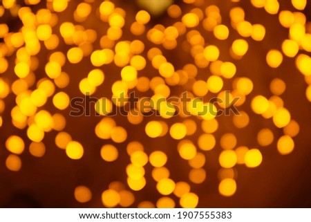 Yellow bokeh on a black background, can be used as a background