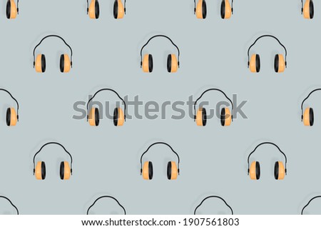 Headphones seamless pattern. Seamless pattern on the theme of headphones, music.
