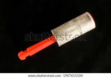 Close-up of sticky cleaner Object on a black Background