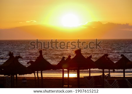 Photo Picture of The Sun Setting in the Sea