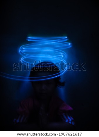 a small child surrounded by light