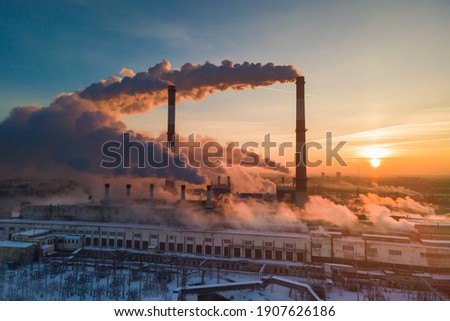 Industrial factory pollution, smokestack exhaust gases. Industry zone, thick smoke. Climate change and global warming Royalty-Free Stock Photo #1907626186