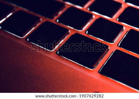 Black laptop keyboards with lighting effects