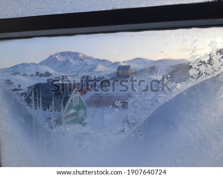 Snowflake in window, greenland lifestyle, winter scenery 