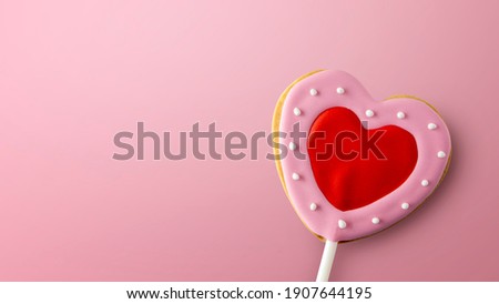 happy valentine's day concept. heart shaped cookies on pink background. space for text. flat lay. top view