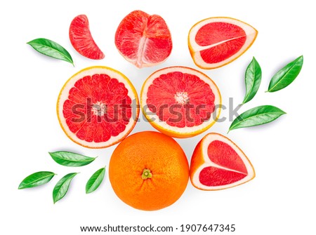 Grapefruits isolated  on white background, top view. Citrus fruits pattern. Creative layout made of Grapefruit slices and green leaves. Top view. Flat lay. Royalty-Free Stock Photo #1907647345