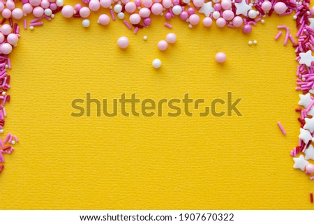 Decorations for pastry on yellow background