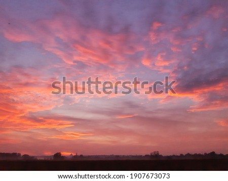 colorful sunset sky clouds twilight Royalty-Free Stock Photo #1907673073