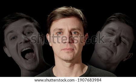 Bipolar personality disorder - Face of young adult man Royalty-Free Stock Photo #1907683984
