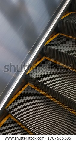 A picture with a little view of the escalator.