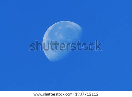 big moon against blue sky