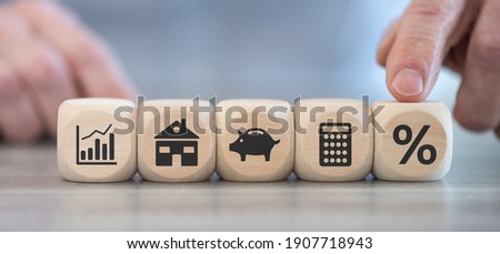 Concept of interest rates with icons on wooden cubes