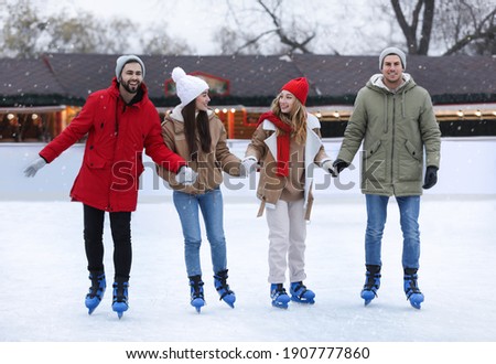 Group of friends at outdoor ice rink