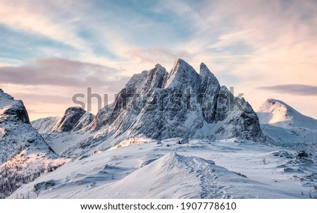 Scenery of Majestic snow mountain with footprint on Segla hill in the morning at Senja Island, Norway Royalty-Free Stock Photo #1907778610