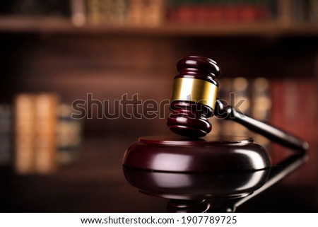 Law and justice. Wooden judge gavel, close-up view. Royalty-Free Stock Photo #1907789725