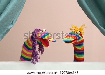 Creative puppet show on white stage indoors Royalty-Free Stock Photo #1907806168
