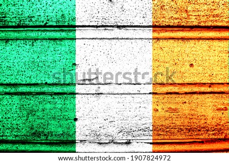 National flag of Ireland, abbreviated with ie; a realistic 3d image of the national symbol from an independent country painted on a wooden wall