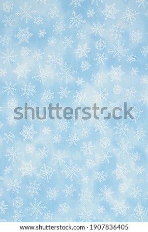 Blue snowflake background with copy space for winter or holiday backgrounds