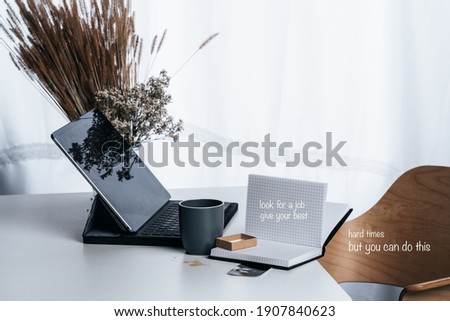 a photographed workplace in the office with text banner for home office or job search