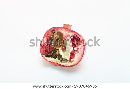 spoiled pomegranate. Top view. on white background 