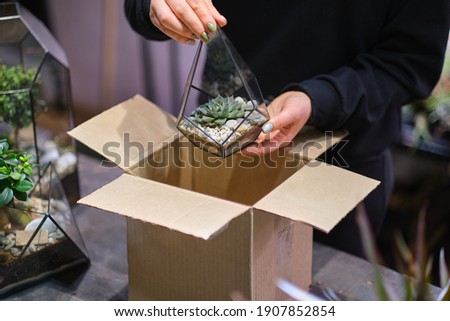 Online small business owner. delivery, mail service, people and shipment concept close up of woman packing parcel box. Female small business owner parcel box.