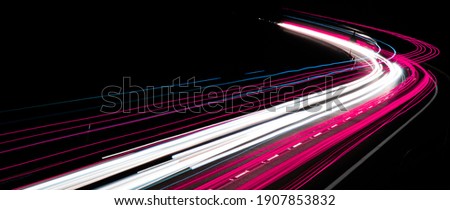 abstract red car lights at night. long exposure Royalty-Free Stock Photo #1907853832