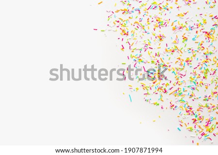 color background, sprinkling on white background  Royalty-Free Stock Photo #1907871994