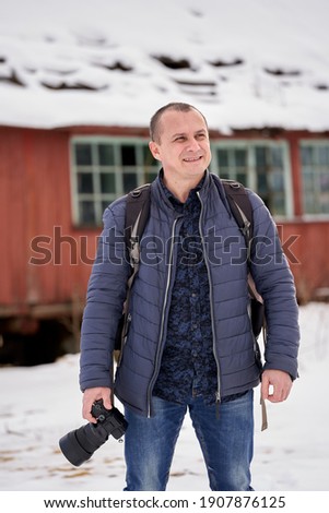 Caucasian middle age man in a beautiful winter landscape