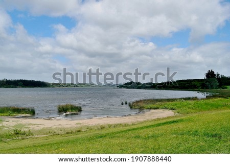 Photography of a beautiful lagoon, the beach and the opposite coast