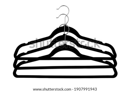 Black clothes hangers isolated on white background.