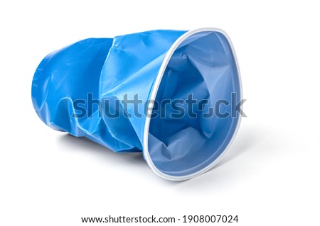 a battered blue plastic cup, insulated on a white background Royalty-Free Stock Photo #1908007024