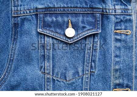 Classic jeans texture, close-up. Blue denim jacket, jeans background. Royalty-Free Stock Photo #1908021127