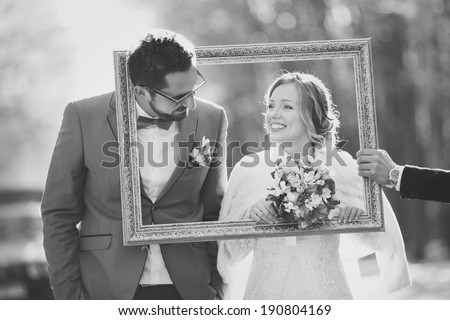Black and white picture of happy wedding couple together. Groom and bride in frame. Royalty-Free Stock Photo #190804169