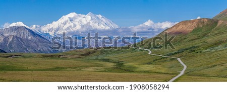 Denali, also referred to simply as "The Mountain", is the crown jewel of Denali National Park. As North America's highest peak it is an impressive sight not only in height but also sheer mass.  Royalty-Free Stock Photo #1908058294