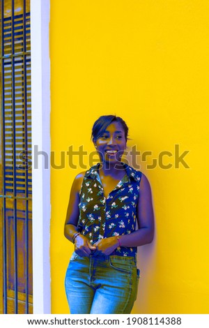 Photograph of a young, African American woman with a colorful background. Lifestyle in Cali Valle del Cauca Colombia.