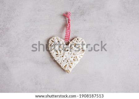 White handmade heart on gray background. Valentine's Day. Banner. Copy space.