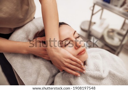 The woman is massaged face and body. High quality photo
