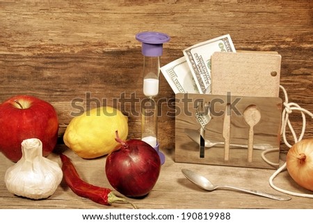 Still-life with fruits, vegetables, money and  vintage notepad