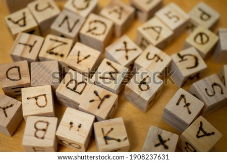 Many capitalized English dice scattered
