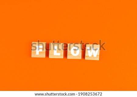 FLOW word isolated on an orange background