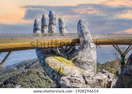 Famous tourist attraction - Golden bridge at the top of the Ba Na Hills, Vietnam Royalty-Free Stock Photo #1908296614