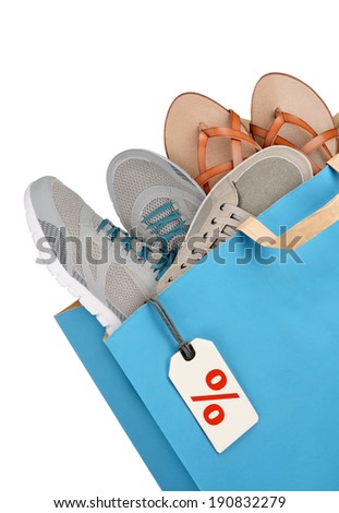Shopping bag with footwear isolated on white background