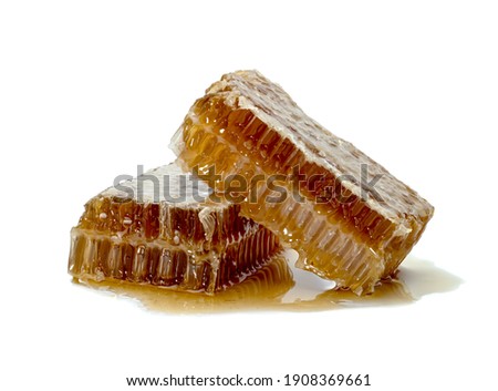 Fresh Honeycomb slice and honey isolated on white background 