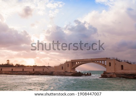 Alexandria, Egypt. Coastal landscape with Montazah bridge under colorful cloudy sky