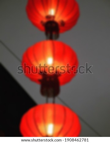 red paper lantern hanging for decorations blur.  suitable for Chinese new years celebrate articles blurry background 