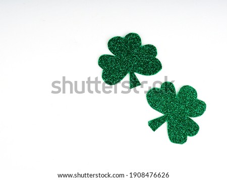 green clovers or shamrocks, Green hat isolated on white background. St. Patrick's Day Holiday concept. Spring background